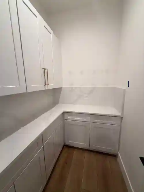 Custom pantry cabinetry and quartz counters installed by Braga Remodeling