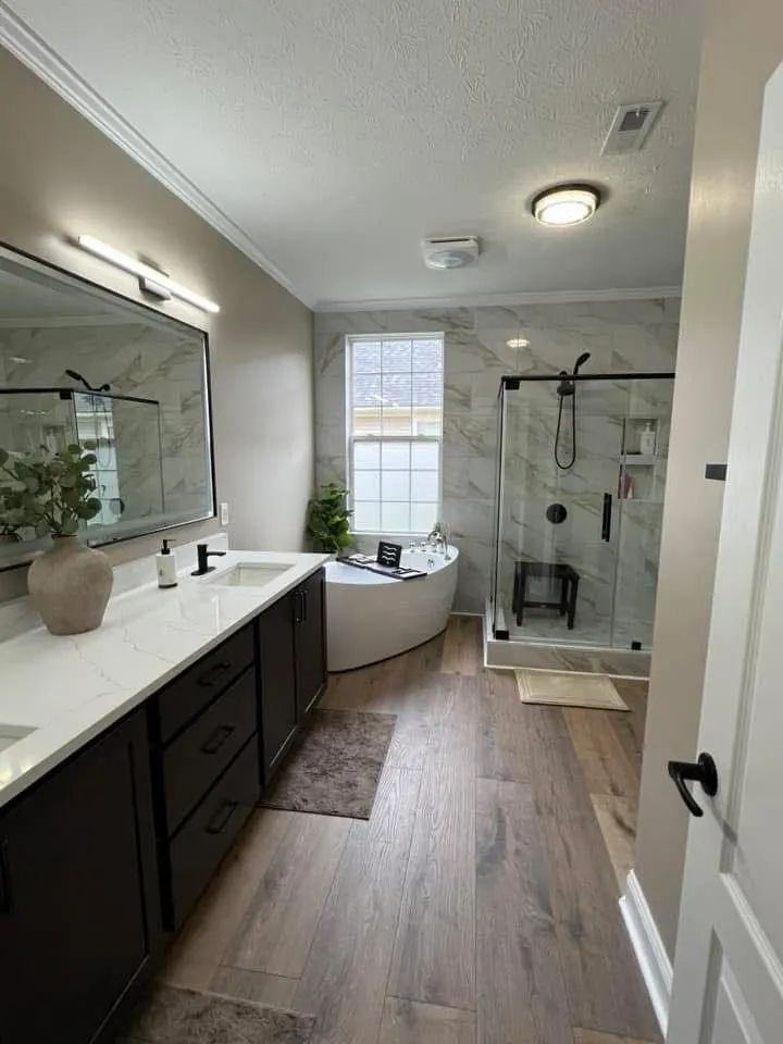 Braga Remodeling primary bathroom with bathtub and plank-style tile floor
