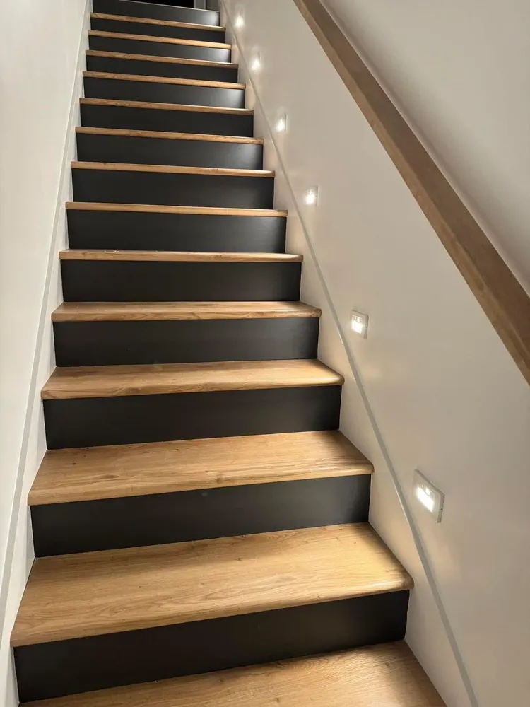 Staircase with wood-look treads finished by Braga Remodeling