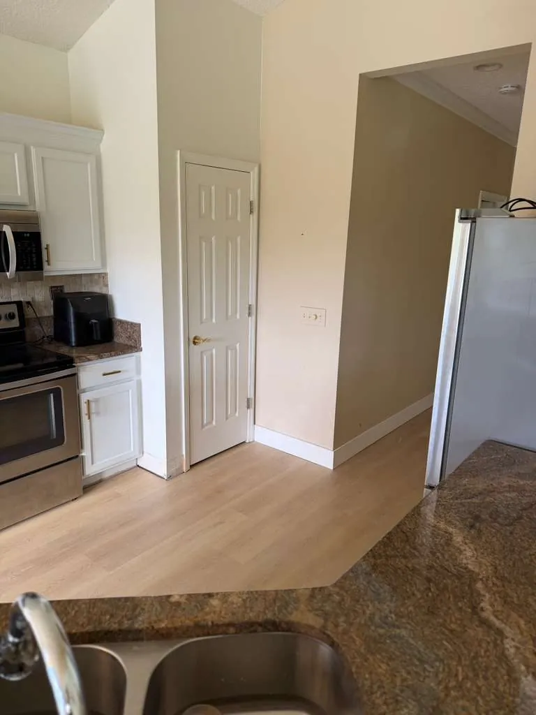 Kitchen update with countertops and vinyl plank flooring by Braga Remodeling