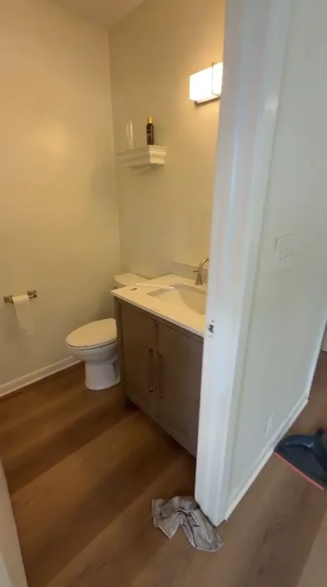 Luxury vinyl plank installed in a half bath by Braga Remodeling, Jacksonville FL