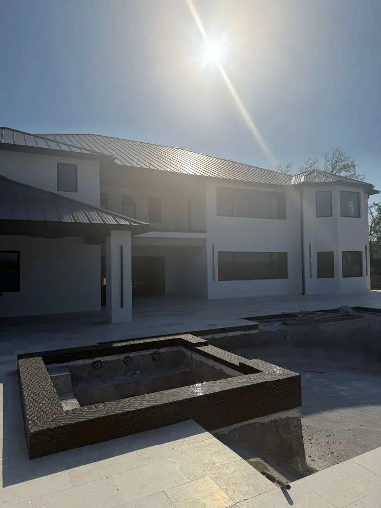 Paver pool deck and patio surround installed by Braga Remodeling in Northeast Florida
